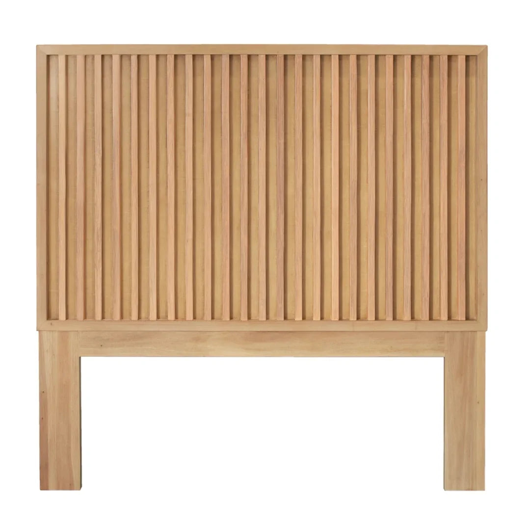Natural wood slatted headboard in a modern boho style.
