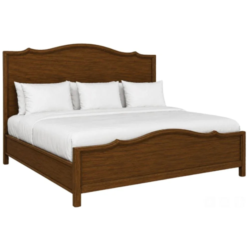 French country wooden bed frame with arched headboard and footboard, styled with white linens
