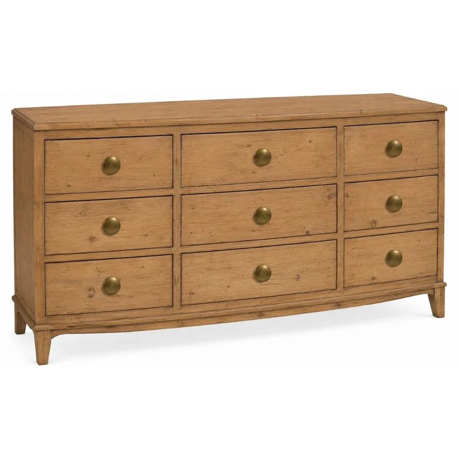 Natural wood farmhouse dresser with 9 drawers and antique brass knobs.