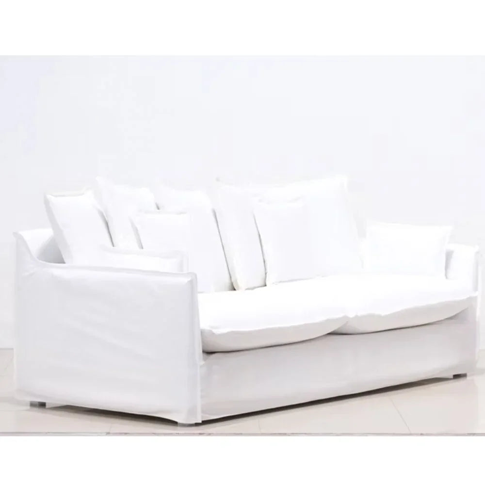 White modern slipcovered sofa with plush cushions, ideal for coastal or farmhouse living rooms