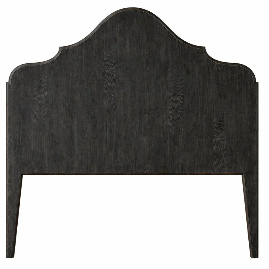 Dark wood arched headboard with farmhouse style design and visible grain texture