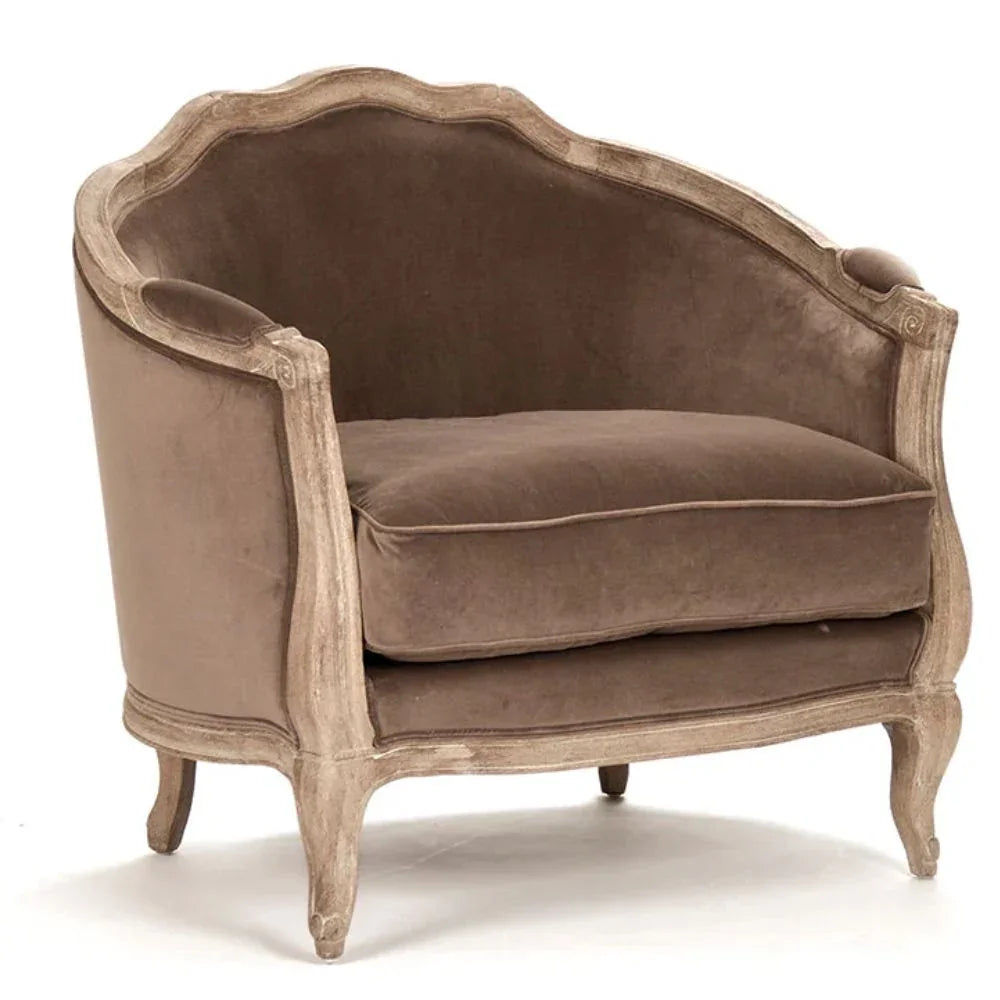 Elegant French country armchair with distressed wood frame and plush velvet upholstery