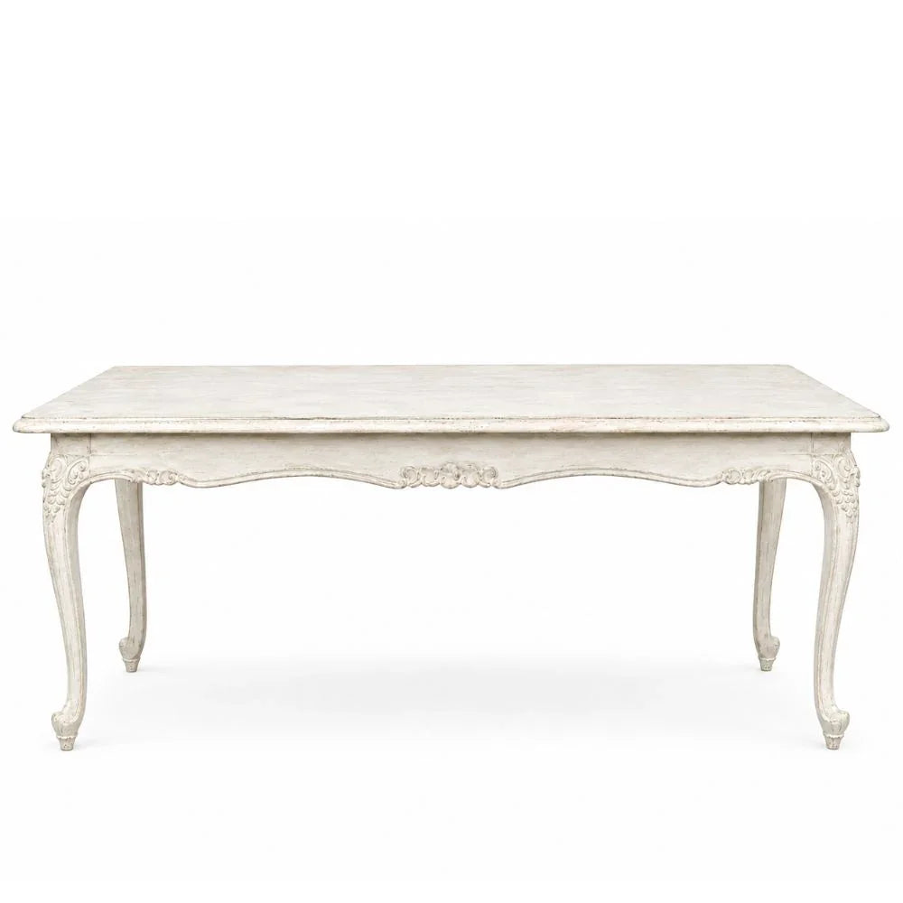 Elegant shabby chic coffee table with carved legs and distressed white finish, perfect for French country decor