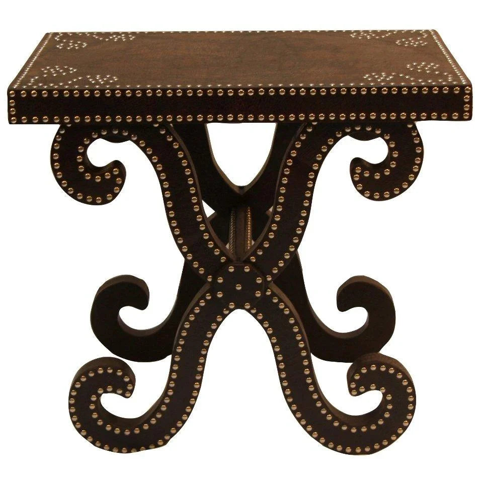 Dark wood console table with ornate scroll legs and brass nailhead trim, French country style