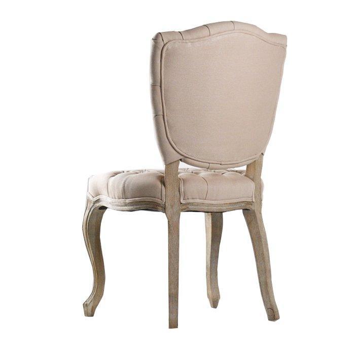 Elegant French country dining chair with tufted upholstery and curved wooden legs