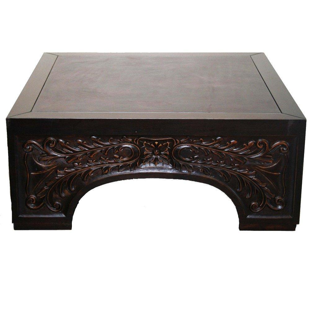 Dark wood coffee table with ornate floral carvings, French country style furniture