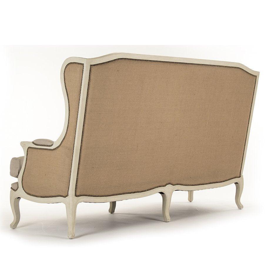 French country sofa with curved back, nailhead trim, and light gray painted legs
