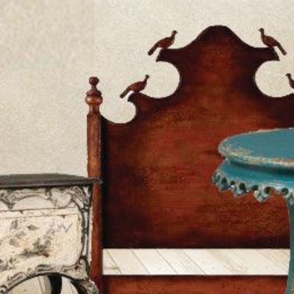 Rustic wooden headboard with carved birds, shabby chic nightstand, and turquoise side table in farmhouse bedroom