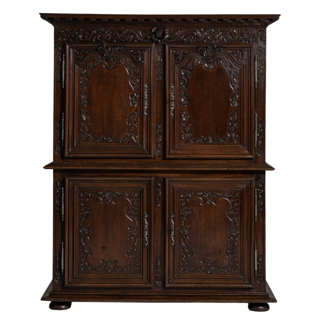 French circa 1800 solid oak cabinet with ornate carvings, four doors, shelves, and blue interior.