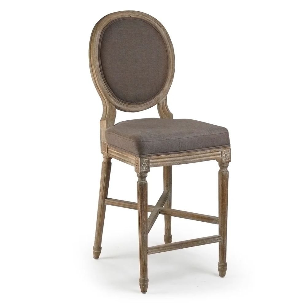 French country bar stool with oval back, distressed wood frame, and taupe upholstery