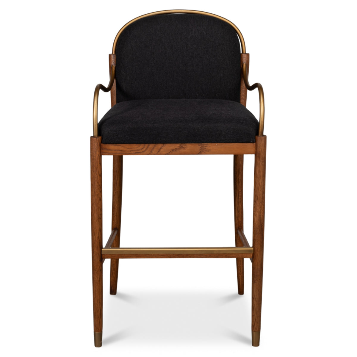 Aurelle black upholstered oak bar stool with curved backrest, brass-finished metal arms, tapered legs, and supportive footrest.