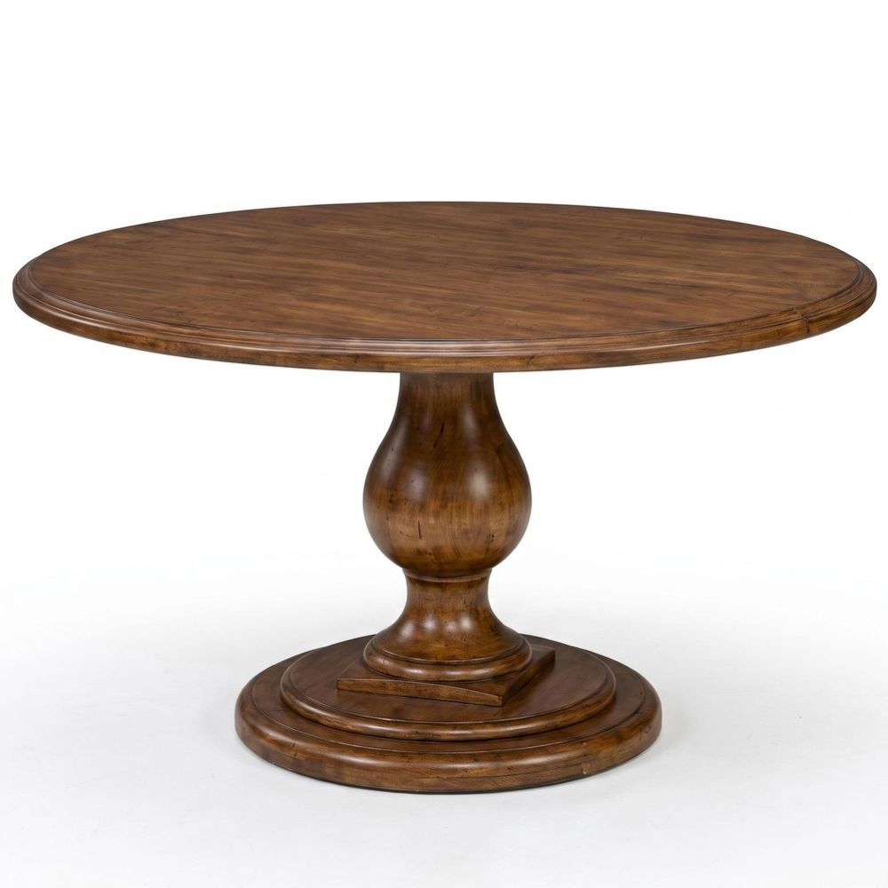 A round wooden pedestal dining table with a medium brown finish and visible wood grain, photographed on a clean white background.