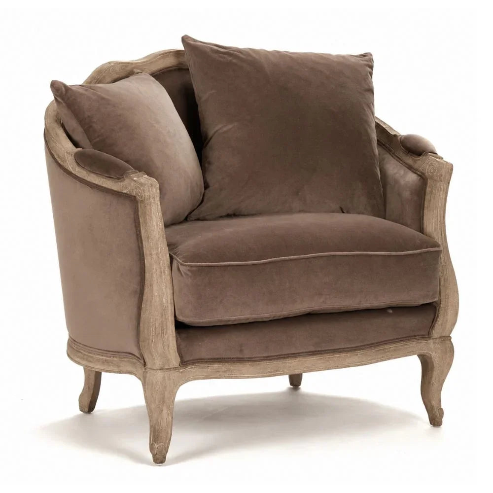 Elegant French country armchair with plush brown velvet cushions and carved wooden frame