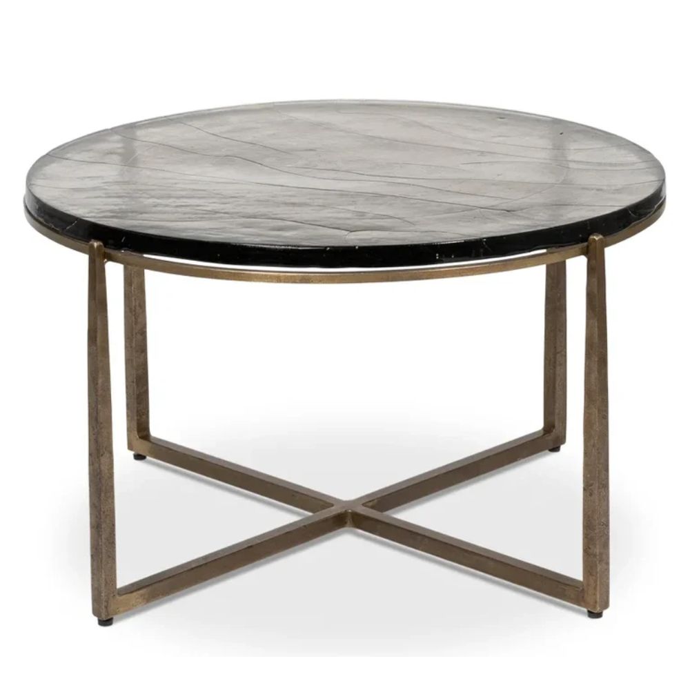 Round coffee table with black marble top and gold metal X-base, modern farmhouse style