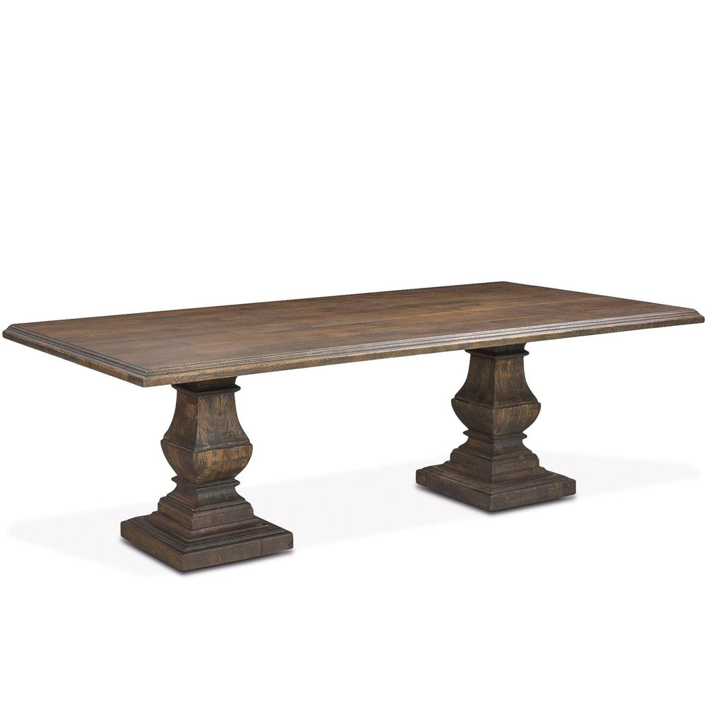 Rustic brown farmhouse dining table with carved pedestal bases.