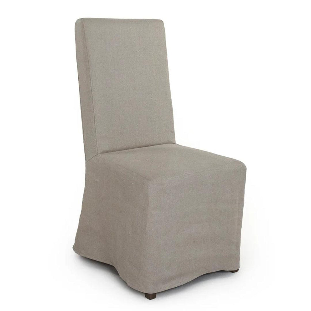 Natural linen slipcovered dining chair in farmhouse style with clean lines and soft fabric
