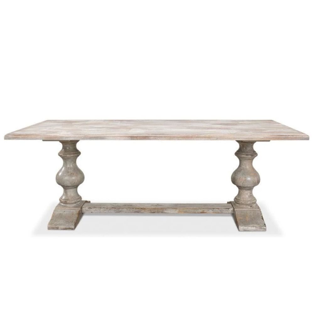 Rustic farmhouse dining table with distressed finish and turned pedestal legs, perfect for shabby chic or coastal decor