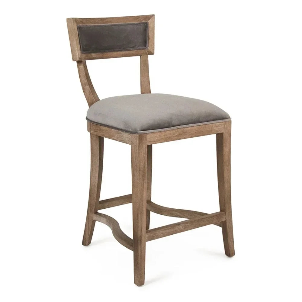 Rustic wooden bar stool with gray upholstered seat and back panel, farmhouse style