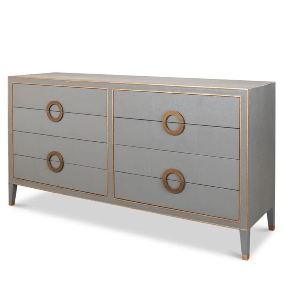 Grey 6-drawer dresser with gold ring pulls and trim in a modern style.