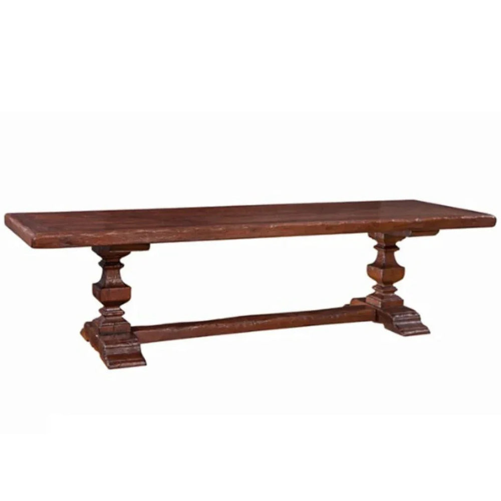 Rustic French country wooden trestle table in a dark brown finish.