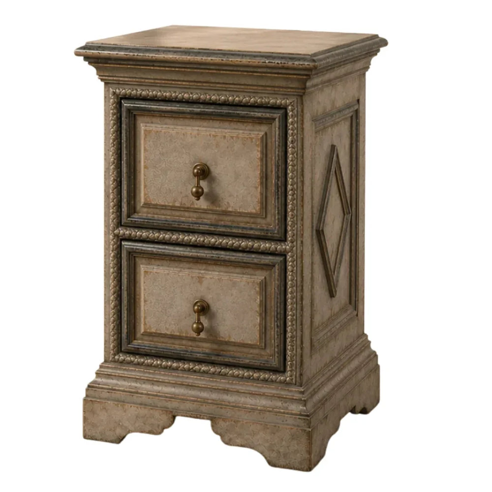 French country style distressed beige two-drawer nightstand with antique brass knobs.