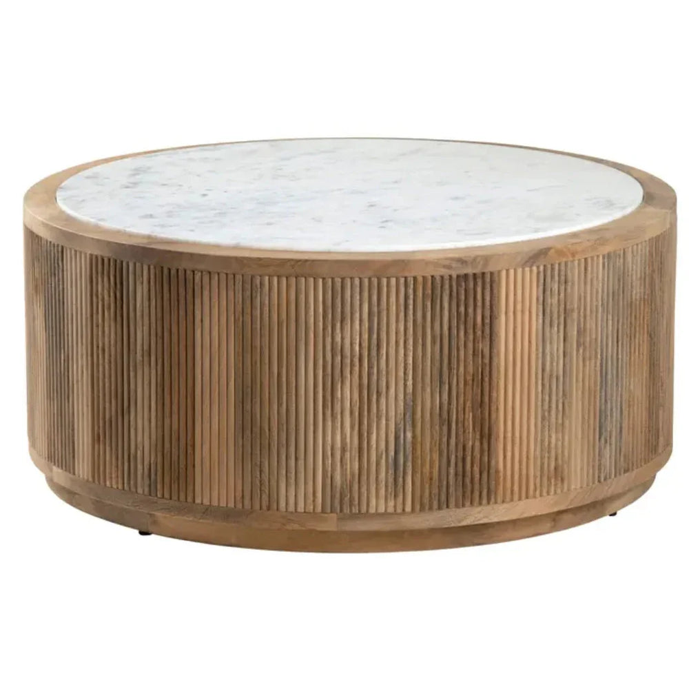 Round marble top coffee table with fluted wood base in a natural boho style.