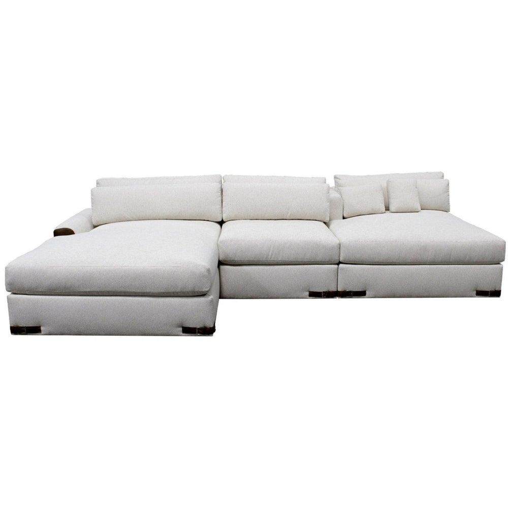 White fabric sectional sofa with chaise lounge in a modern farmhouse style.