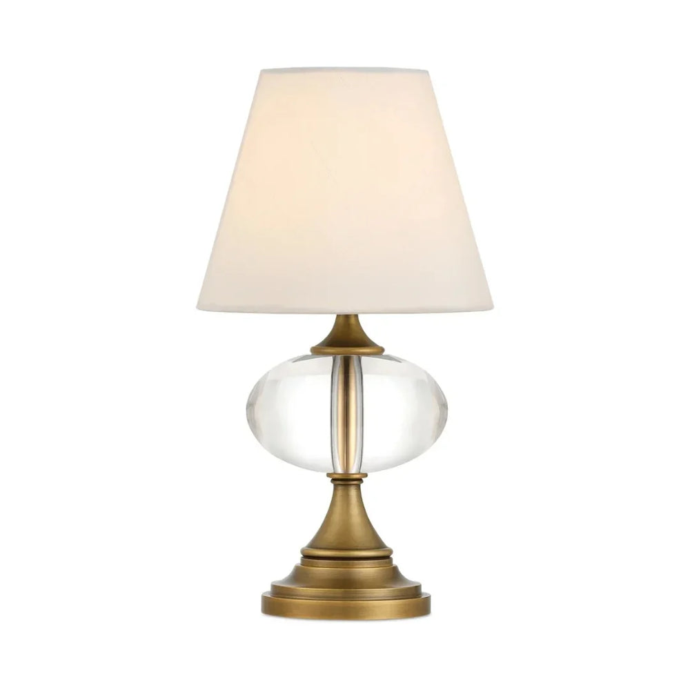 Elegant glass table lamp with a brass base and cream fabric shade in a French country style.