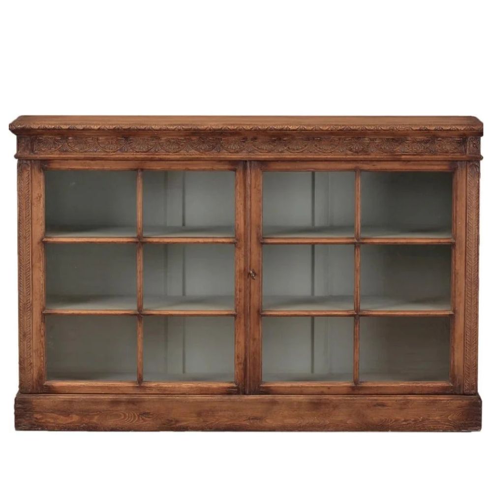 Antique French country brown wood display cabinet with glass doors and carved detailing