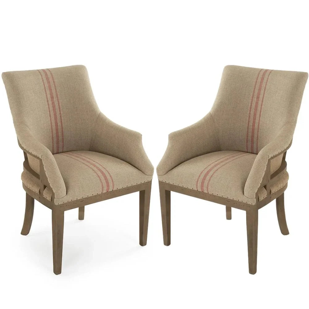 French country armchairs with striped upholstery and nailhead trim, rustic wooden legs