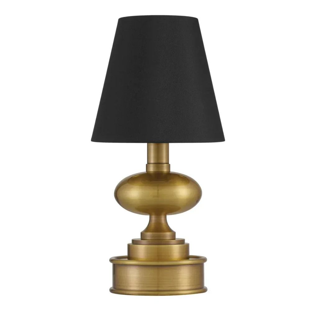 Brass table lamp with a black fabric shade in a classic farmhouse style.