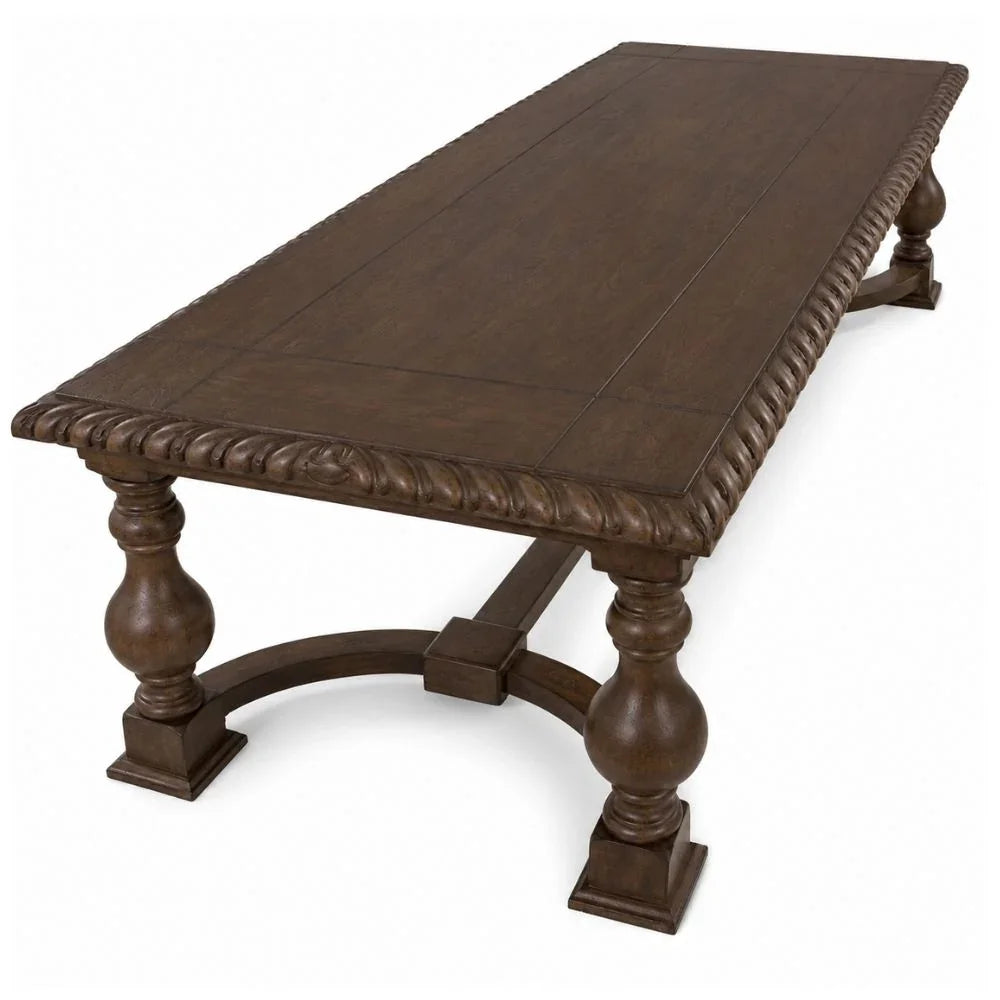 A dark brown wooden dining table with a rectangular top, decorative rope-style carved apron, turned legs, and an arched stretcher base, shown on a white background.
