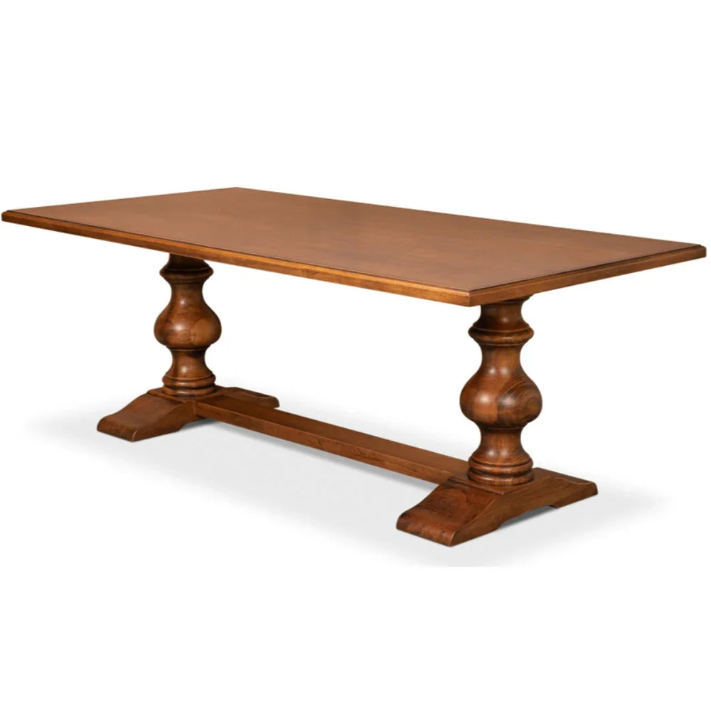 Solid wood farmhouse dining table with turned pedestal legs, rustic French country style