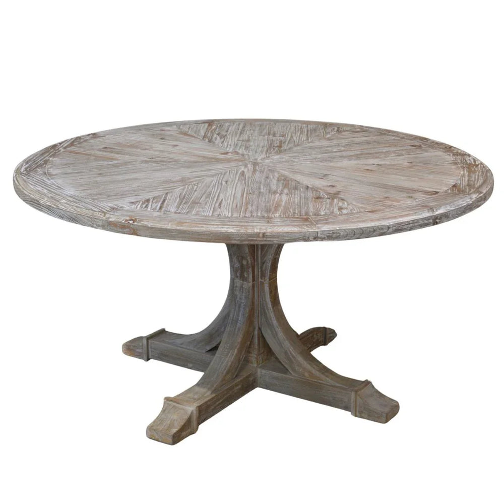 Rustic round wooden pedestal dining table in a weathered French country style.
