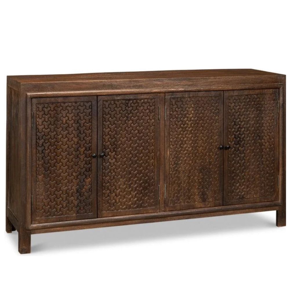 Rustic brown wood sideboard with carved pattern doors in a natural boho style.