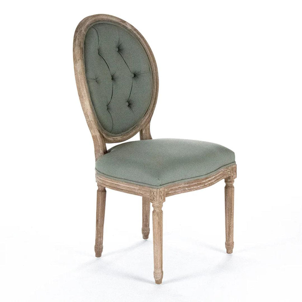 French country oval medallion chair in sage green tufted fabric with weathered wood frame.