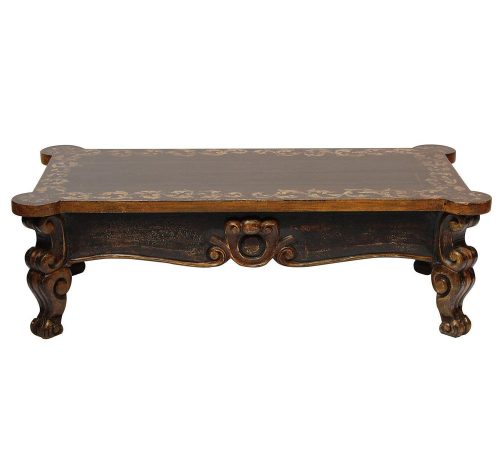 French country style dark wood coffee table with gold floral accents and ornate carved legs