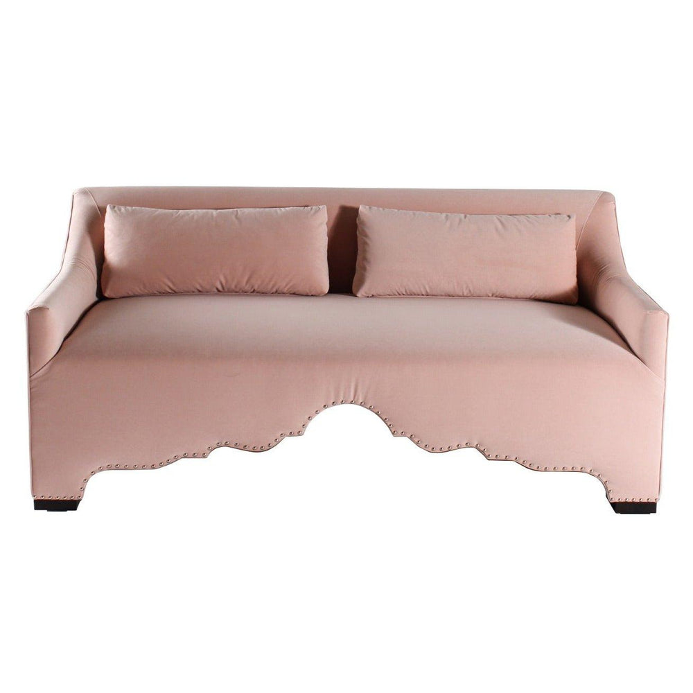 Blush pink French country style sofa with nailhead trim and matching lumbar pillows.