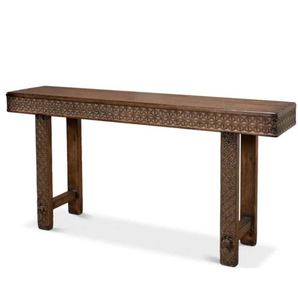 Hand-carved brown wooden console table with intricate geometric patterns in a rustic style.