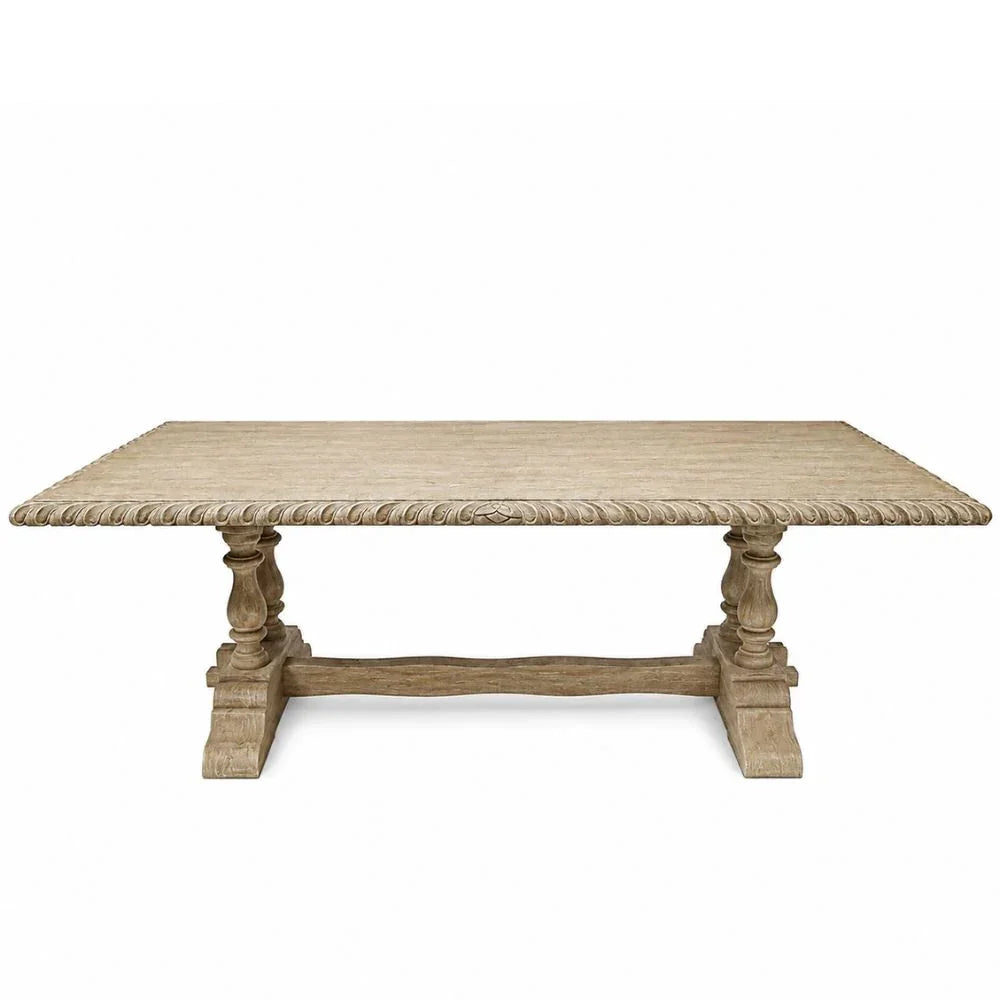 A rustic rectangular wooden dining table with a textured woven tabletop and carved turned legs, shown against a plain white background.