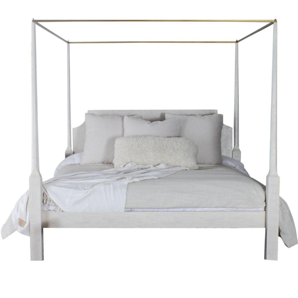 Elegant white canopy bed with soft linens and fluffy pillow, perfect for shabby chic or farmhouse decor