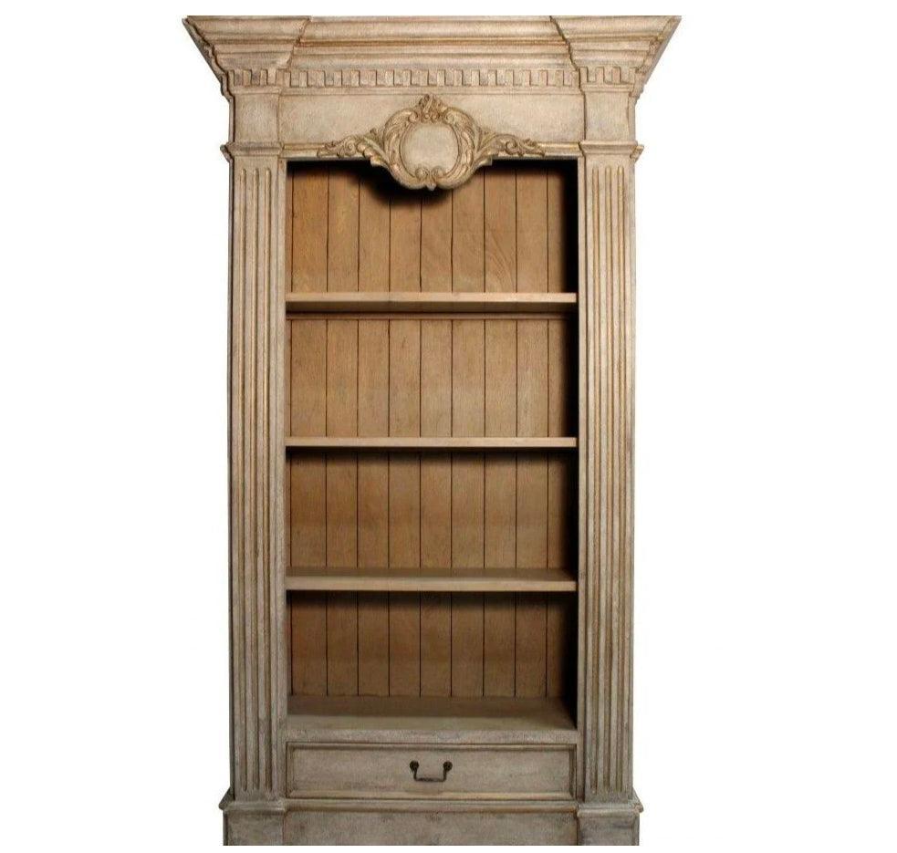 Elegant French country bookcase with ornate detailing and rustic wood shelves