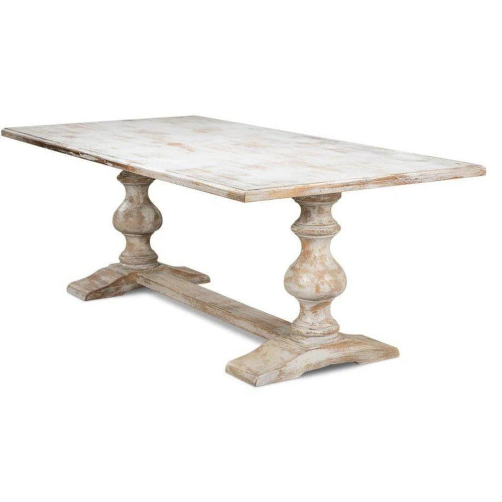 Distressed white farmhouse dining table with turned pedestal legs, rustic shabby chic style