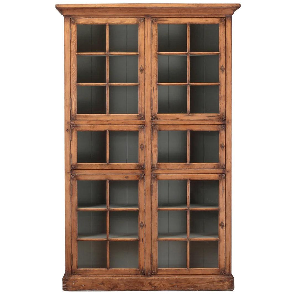 Large rustic wood bookcase with glass pane doors in a French country farmhouse style.