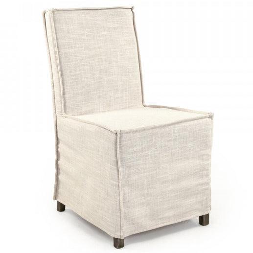 Beige linen slipcovered accent chair in a French country style.