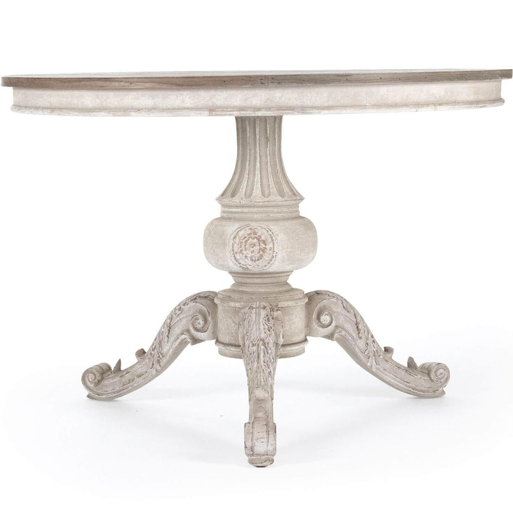Round white distressed pedestal dining table in French country shabby chic style.